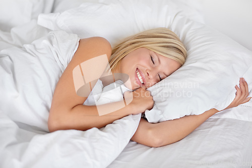 Image of Sleep, woman in bed and happy wake up, morning with pillow and blanket in bedroom and healthy night rest on weekend. Girl, peace and thinking about day or sleeping, wellness and routine in home