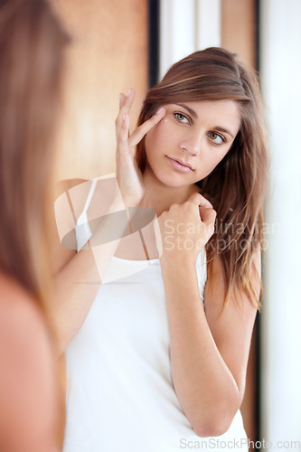 Image of Skincare, woman with cream on her face and in her bedroom of her home. Health wellness or skin care, makeup and female person apply lotion for beauty cosmetics or facial treatment at her house