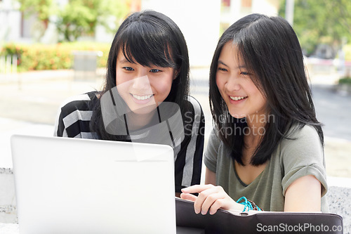 Image of Smile, education and students with a laptop on campus for research, studying and project together. College, Asian and women reading an email on a computer, learning and happy with university work