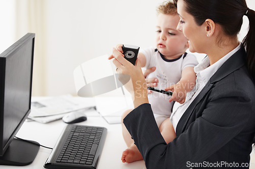 Image of Woman, home office and phone with baby, computer and care with smile, teaching and multitasking at desk. Happy mother, young kid and cellphone for playing, bond and remote work at pc in family house