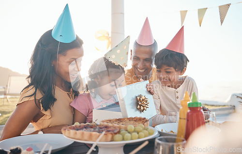 Image of Birthday, surprise and family outdoors for party, celebration and present, happy and excited. Parents, children and gift for girl child at special event, wow and celebrating with food at restaurant