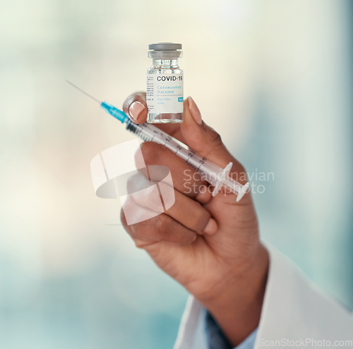 Image of Healthcare, close hand of doctor with syringe and covid vaccine at a hospital. Medication, treatment and nurse or surgeon hands with medical injection needle for health wellness for corona virus