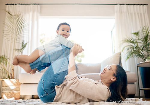 Image of Home, love and mother play with baby for family bonding, quality time and child development together. New born, motherhood and happy mom carry infant for care, support and relationship in living room