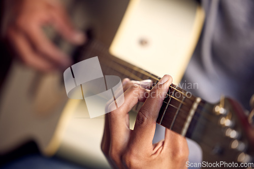 Image of Playing guitar, music and hands of a man on an instrument, learning and strumming for entertainment. Jazz, talent and closeup of a male musician with acoustic music, practicing and instrumental hobby