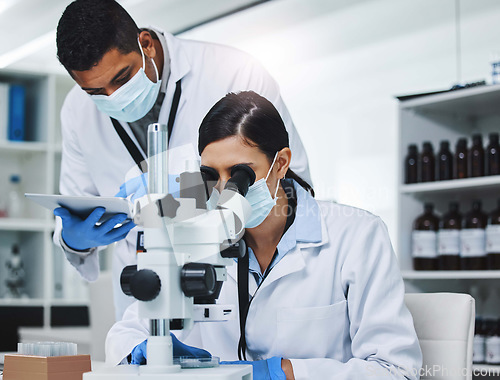 Image of Science, tablet and man and woman with microscope for research, medical analysis and report in lab. Healthcare, biotechnology and team of scientists with equipment for sample, experiment and medicine