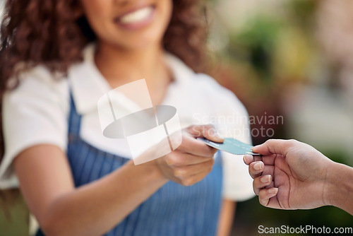 Image of Woman waiter, hand and credit card payment at a shop with barista and smile outdoor. Purchase, working and shopping with customer service and female retail worker with store employee and cafe pay