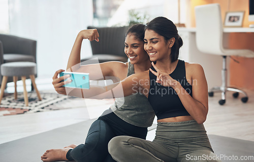 Image of Exercise, peace sign and selfie of women together at home for social media memory or post. Indian sisters or female friends with a photo for influencer update, fitness motivation or muscle results