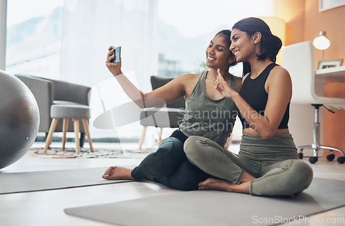 Image of Exercise, peace sign and selfie of women together at home for social media blog post. Indian sisters, female friends and in lounge for online influencer update, fitness photograph and happy emoji