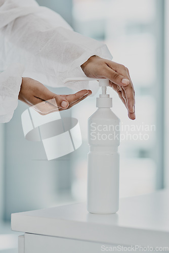 Image of Hand sanitizer bottle, doctor hands and Covid rules with health policy, disinfection and safety from virus. Medical person, healthcare compliance for corona and disinfecting closeup with hygiene