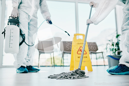 Image of Covid disinfection, cleaning hospital floor with mop and healthcare compliance for safety and hygiene. Disinfecting liquid, cleaner people in PPE for protection from corona virus with medical policy