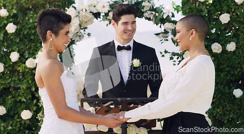 Image of Love, holding hands and gay with lesbian couple at wedding for celebration, lgbtq and pride. Smile, spring and happiness with women at event in garden for partner commitment, queer and freedom
