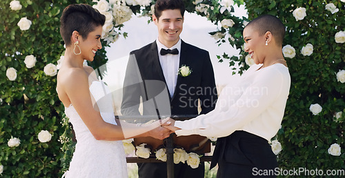 Image of Love, holding hands and gay with lesbian couple at wedding for celebration, lgbtq and pride. Smile, spring and happiness with women at marriage event for partner commitment, romance and freedom