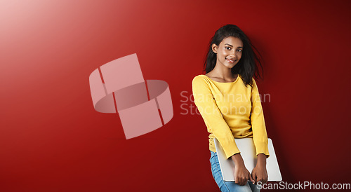 Image of Woman, student and smile portrait with a laptop for university and school work with mockup. Isolated, red background and education work of a young Indian female person with computer for college