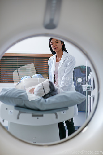 Image of Mri, doctor and woman comfort patient in hospital before scanning in machine. Ct scan, comforting and medical professional with senior female person before radiology test for healthcare in clinic.