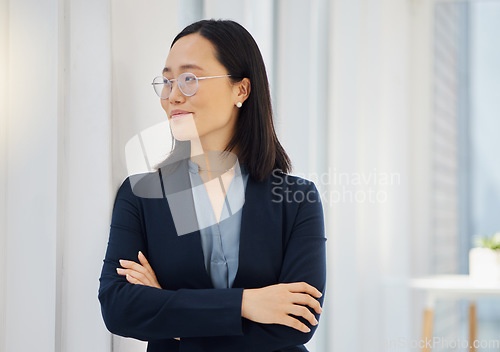 Image of Office window, arms crossed and confident Asian woman looking at workplace view, happy and thinking about startup growth. Entrepreneurship success, pride and business person smile in Japan company HQ