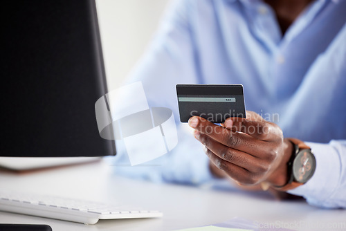 Image of Hand, black man and computer with credit card, office and online shopping for deal, discount and payment. African customer, cyber security and e commerce with desktop, pc and fintech in workplace