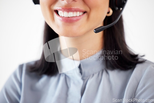 Image of Agent call center, closeup mouth of a woman and with a headset at her modern office. Consultant or customer service, support or networking and crm with a female person smile at her workstation