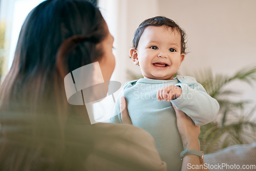 Image of Family, love and mother play with baby for bonding, quality time and child development together at home. New born, motherhood and happy mom carry infant for care, support and affection in living room