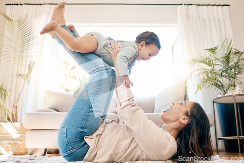 Image of Play, love and mother lift baby for bonding, quality time and child development together in family home. New born, motherhood and happy mom with infant for care, support and playing in living room