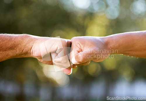 Image of Fist bump, support and team building outdoor with solidarity, power and nature with friends. Respect, people and hands together for trust, teamwork and motivation in park, garden or congratulations