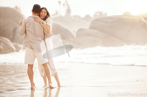 Image of Beach, dancing and happy couple with love, hug and summer celebration, holiday or vacation. Woman with partner or people dance, celebrate and excited in ocean or sea, travel happiness and laughing