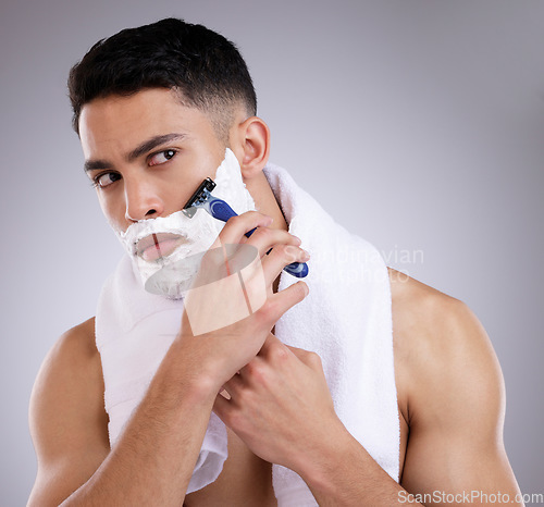 Image of Beauty, shaving and foam with man in studio for hair removal, grooming and skincare. Cosmetics, self care and shower with face of male model on gray background for cleaning, razor blade and product