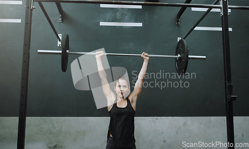 Image of Weightlifting, fitness and woman with barbell in gym for training, exercise and workout for muscles. Sports, deadlift and female body builder lifting weights for challenge, wellness or strength