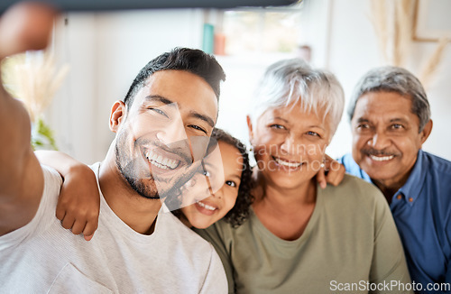 Image of Happy family, portrait smile and selfie in living room for social media, vlog or online post at home. Grandparents, father and child smiling for photo, memory or profile picture together on holiday