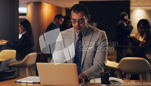 Image of Laptop, corporate lounge and business man focus on company project, online analysis or typing email. Lobby, website and professional person doing research, internet search or working on night report