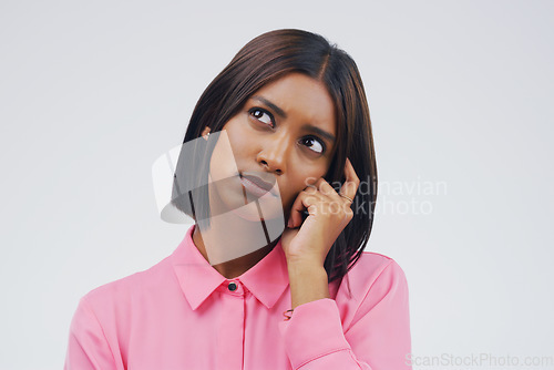 Image of Confused, thinking and woman in studio with decision on mockup, space and white background. Choice, contemplation and indian female person with doubt, emoji and problem solving of ideas for questions