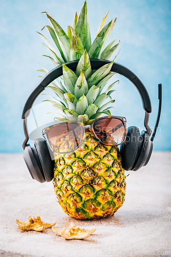 Image of Summer concept - Pineapple hipster in sunglasses and headphones with melon and lemons, creative art fashionable vacation concept