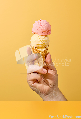 Image of ice cream in human hand