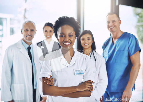 Image of Smile, team and portrait of black woman with doctors, nurses and diversity in hospital with teamwork in healthcare. Health, support and boss, confident doctor with group of medical employees together