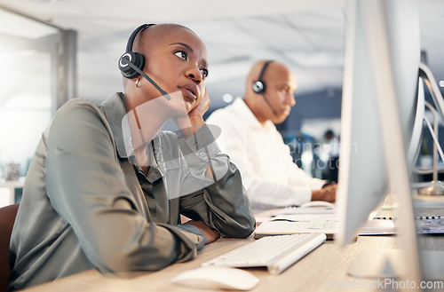 Image of Call center, stress and a woman with a headset at computer with customer account problem. Black person crm support agent at pc for error, mistake or crisis with telemarketing, help desk or sales fail