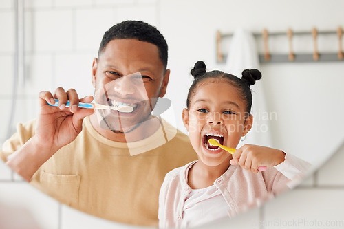 Image of Child, father and brushing teeth in a family home bathroom for dental health and wellness in a mirror. Face of african man and girl kid learning to clean mouth with a toothbrush for oral hygiene