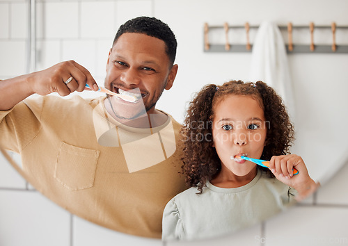 Image of Child, father and brushing teeth in a family home bathroom for dental health. Face of happy african man and girl kid learning to clean mouth with toothbrush in mirror for morning routine or oral care