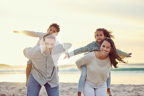 Image of Mother, father and kids piggyback on beach for family holiday, summer vacation and weekend. Nature, travel and portrait of happy mom, dad and child playing by ocean for bonding, fun and quality time
