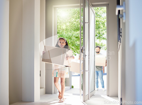 Image of Happy family, real estate and child moving in new home with box for property, mortgage loan or celebration. Mother, father and little girl homeowner walking and carrying boxes together in the house