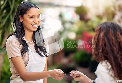 Image of Woman waiter, credit card and store payment at coffee shop with barista and smile outdoor. Purchase, working and shopping with customer service and a female retail worker with happiness from cafe pay