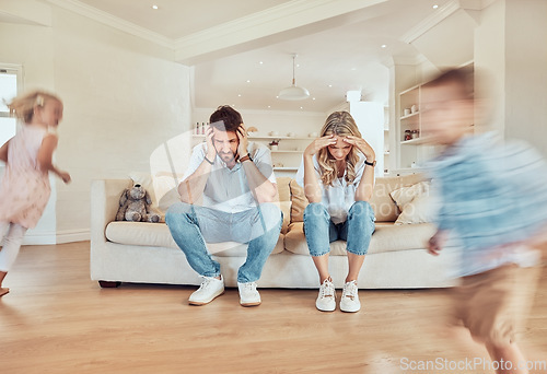 Image of Parents, headache and children running in living room, noise or depression. Stress, mother and father with kids run in lounge, tired and exhausted, burnout or migraine, frustrated and fatigue on sofa