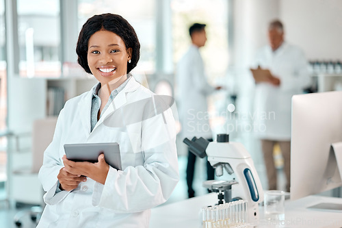 Image of Tablet, black woman and portrait of a scientist in laboratory, hospital or science research for medicine, chemistry or innovation. Doctor, technology and medical worker with smile in clinic or lab