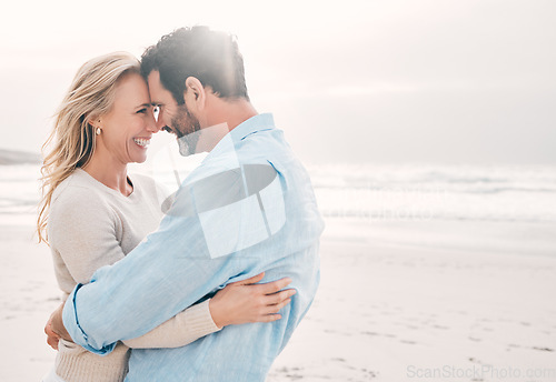 Image of Beach, love and couple touching forehead on holiday, vacation and weekend for anniversary. Mockup space, marriage and happy mature man hugging woman for bonding, quality time and happiness by ocean