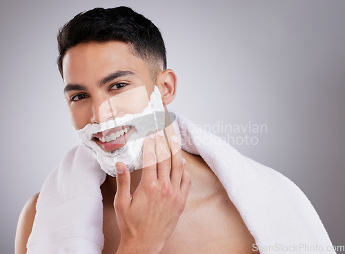 Image of Beauty, shaving and foam with portrait of man in studio for hair removal, grooming and skincare. Cosmetics, self care and shaver cream with face of model on gray background for cleaning and product