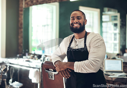 Image of Barber shop employee, hair stylist and black man portrait of an entrepreneur with smile. Salon, professional worker and male person face with happiness and proud from small business and beauty parlor