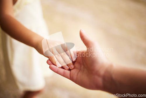 Image of Love, closeup with person with their child and holding hands for support. Care with happy family, help or trust and parent hold her kids hand for compassion or calm with mockup space together