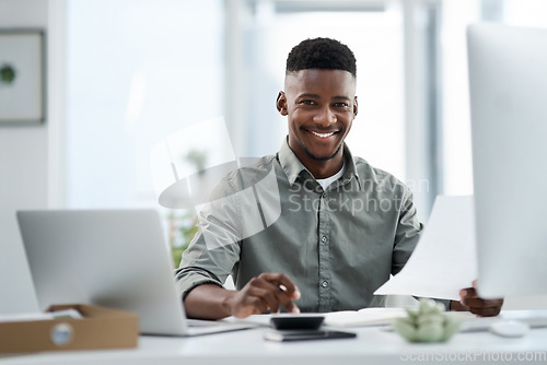 Image of Black man, portrait and laptop with documents for finance, audit or accounting at the office desk. Happy African male accountant or businessman with smile for financial planning, budget or paperwork