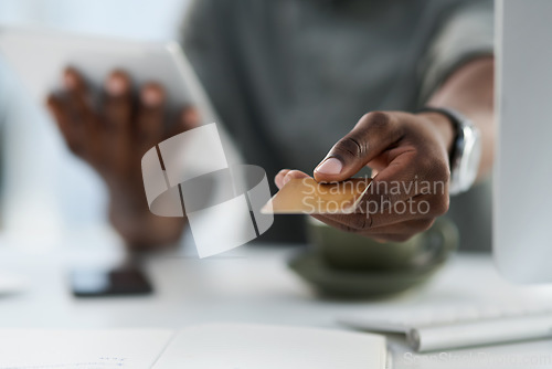 Image of Man, hands and credit card in finance for ecommerce, payment or internet banking on office desk. Hand of male person showing debit for online shopping, purchase or wireless transaction at workplace