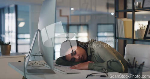 Image of Burnout, tired and woman sleeping at her desk, office or overworked business employee working with fatigue in workplace. Sleep, rest and exhausted corporate businesswoman at company or worker