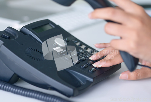 Image of Telephone, call and closeup on receptionist hands for work conversation, communication or telemarketing. Hand, phone and office secretary calling, crm or administration to contact us on a landline