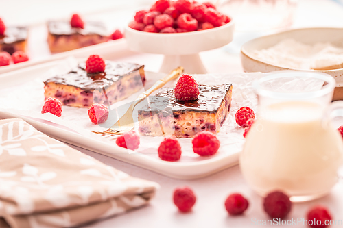 Image of Traditional buttermilk sheet cake with raspberries and  chocolate ganache